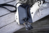 litter-bag-dispenser-labbvenn-saku-black-leather-bag-dispensers-lifestyle-detail-image-paws-the-worthy-bone