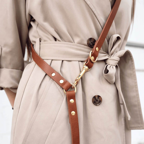 dog-leash-branni-multifunctional-infinity-leashes-cognac-leather-gold-detail-lifestyle-image-human-wearing-assembled-attached-detail-shot-the-worthy-bone